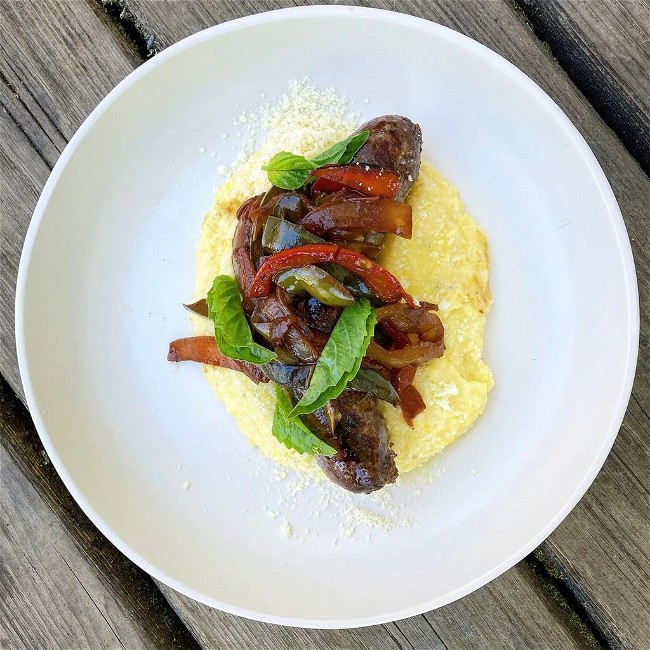 Image of Italian Style Buffalo Sausage Links with Sweet & Sour Peppers and Onions over Ricotta Polenta