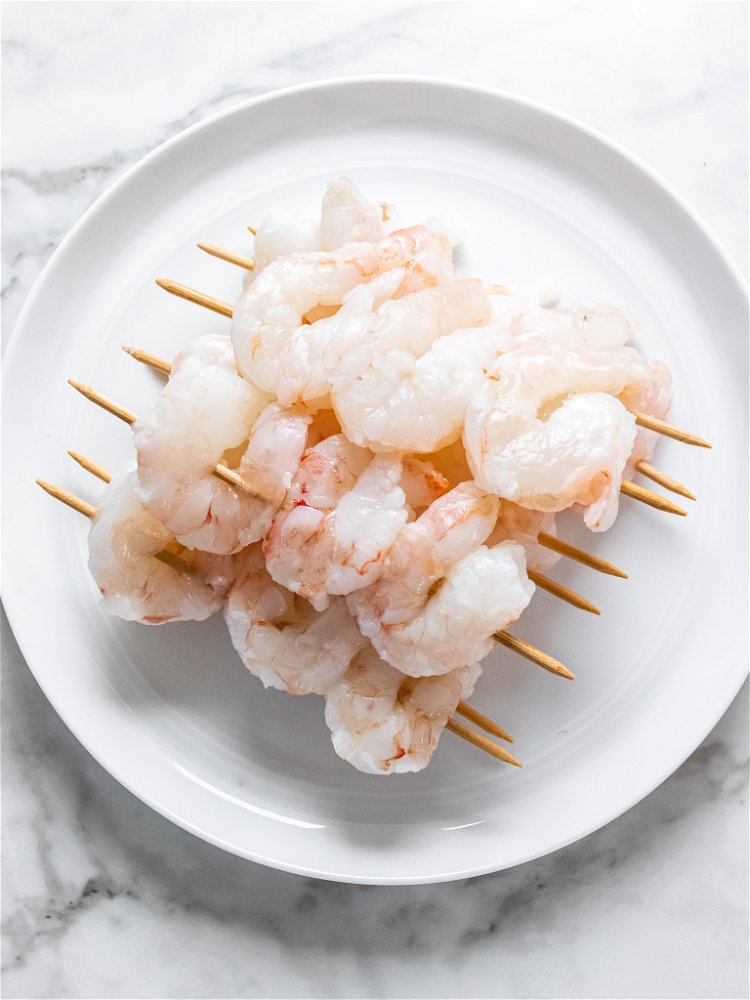 Image of Blot shrimp with paper towel. Place 3 shrimp on 6-inch...