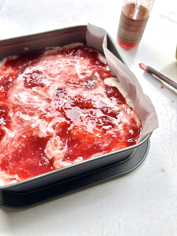 Image of To make Ice Cream Sandwiches line a square or small rectangular casserole dish with a sheet of parchment paper.  