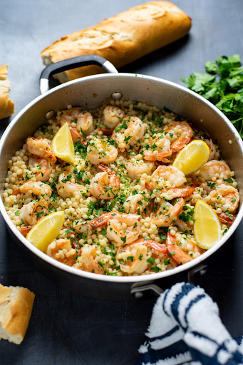 Image of Classic buttery, garlicky, and citrusy shrimp scampi served over Israeli couscous