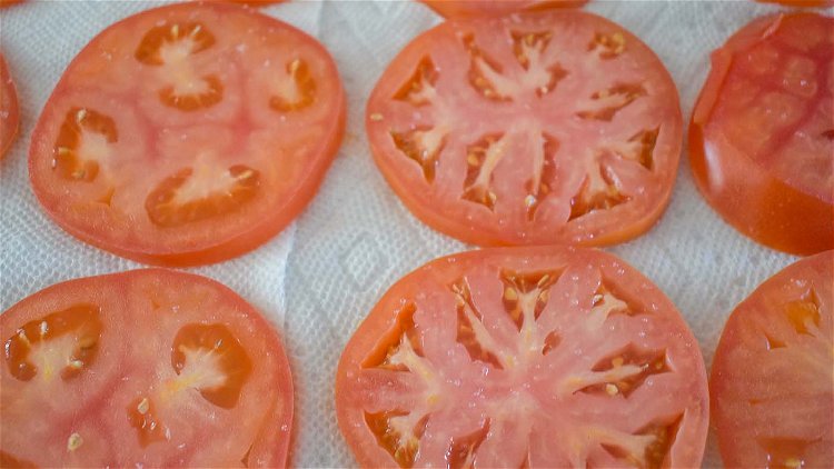 Image of Slice tomatoes approximately 1/4 inch thick and lay on a...