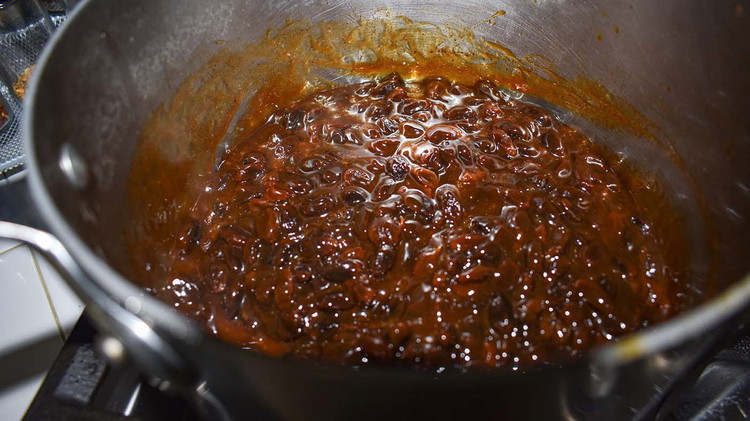 Image of Add to the hot raisin mixture.Cook over medium heat, stirring constantly, until the mixture is clear.