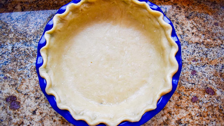 Image of Preheat the oven to 425. Line a 9-inch pie pan with pie crust and set aside.