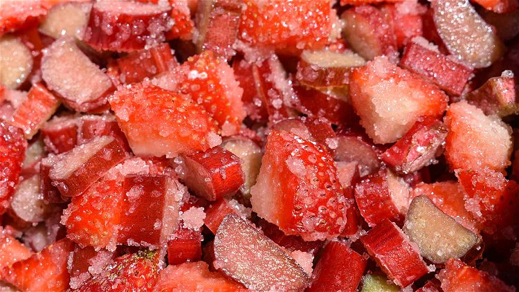 Image of Mix strawberries, rhubarb, sugar, cornstarch, and salt in a large...