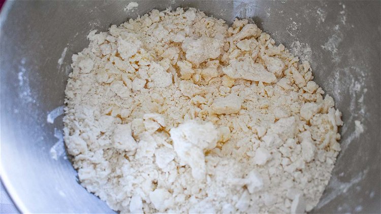 Image of Mix flour with room temperature butter or lard.