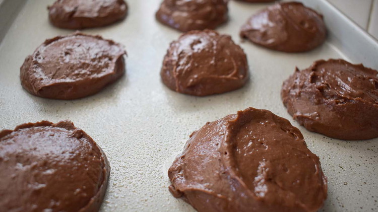Image of Drop by spoon on cookie sheet. Bake at 350 for 8-10 minutes or until firm.
