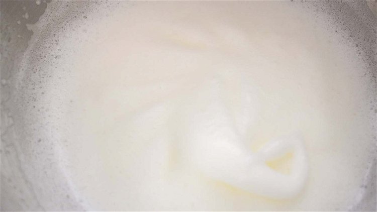 Image of Mix powdered sugar and milk. Combine together egg whites and...