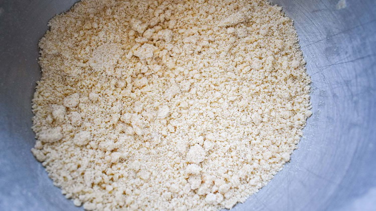 Image of Cut in butter with a fork until the mixture resembles small pebbles.