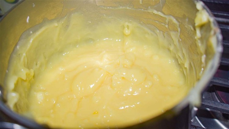Image of Pour into 3 1/4 cups scalded milk, stirring constantly until...