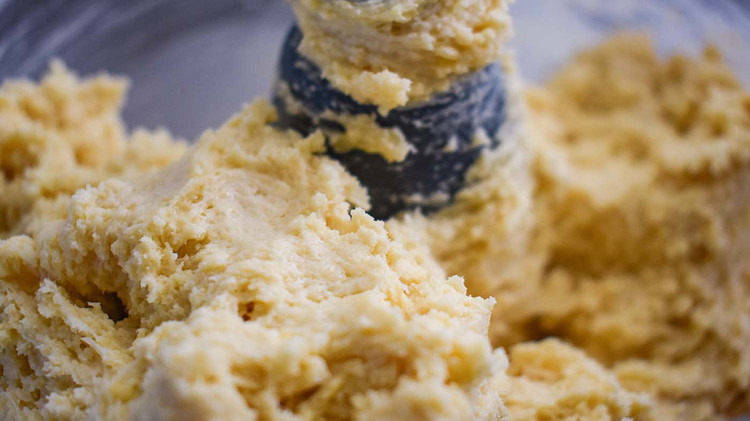 Image of Mix flour, baking powder, salt, sugar, butter, eggs and evaporated milk.