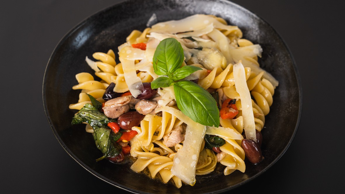 Image of Fusilli with chicken, olives, artichoke, red peppers and basil