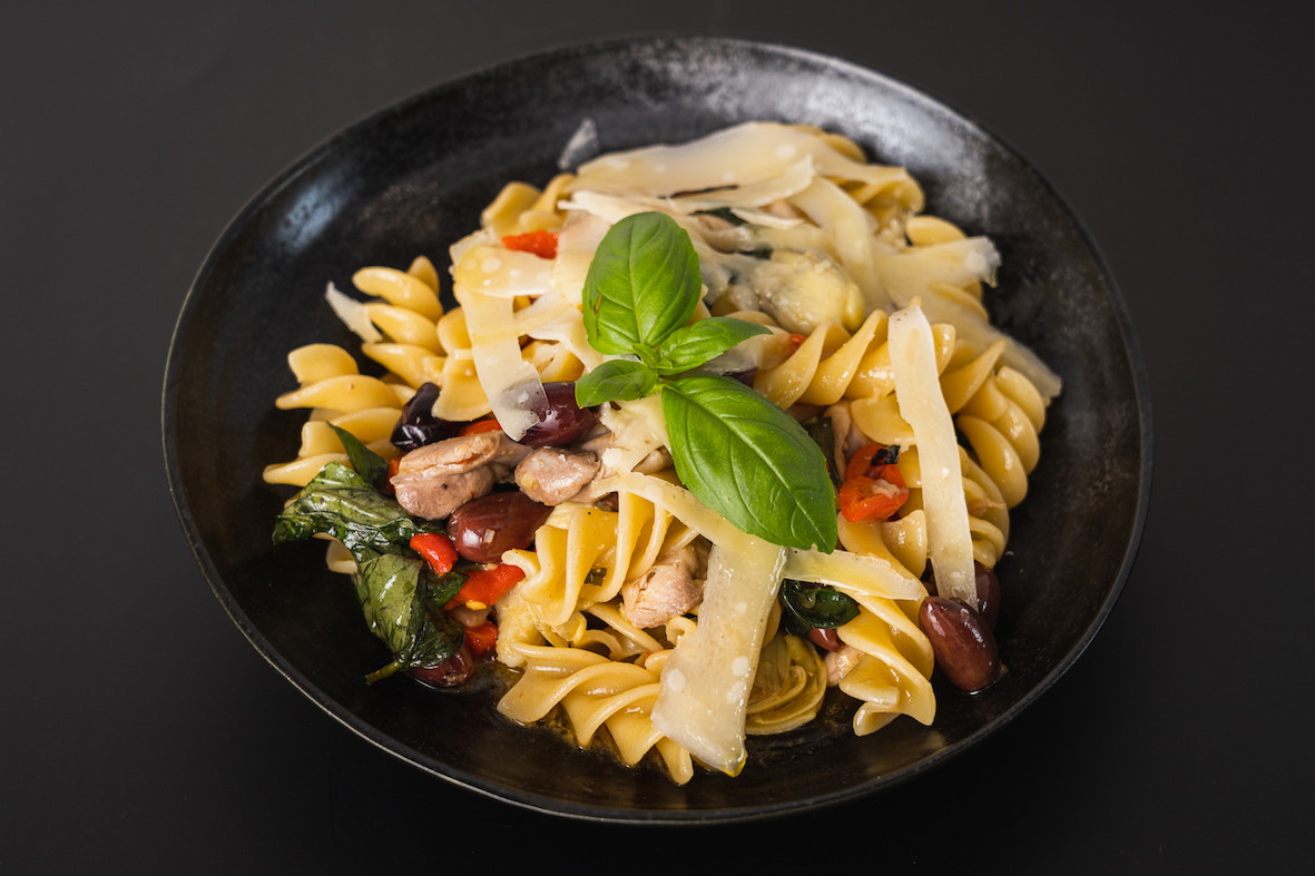Fusilli with chicken, olives, artichoke, red peppers and basil