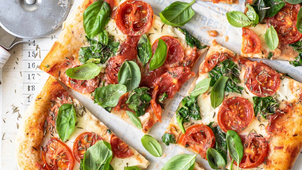 Image of Pizza with tomatoes and basil