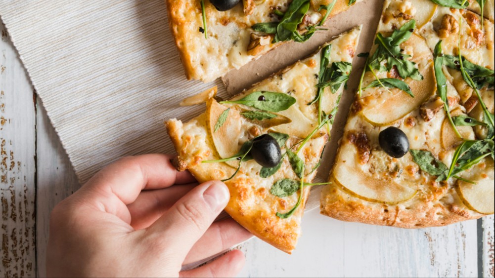 Image of Pizza with pear, thyme, cashew and walnuts