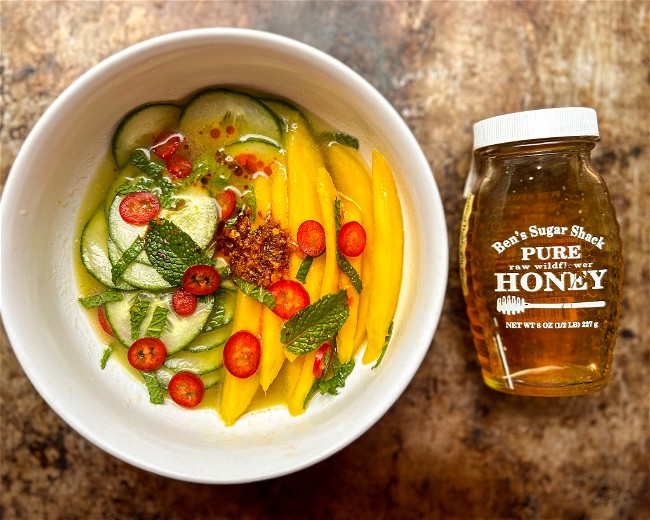 Image of Thai inspired honey - fish vinaigrette with fresh mango, cucumber, red chilies and mint.