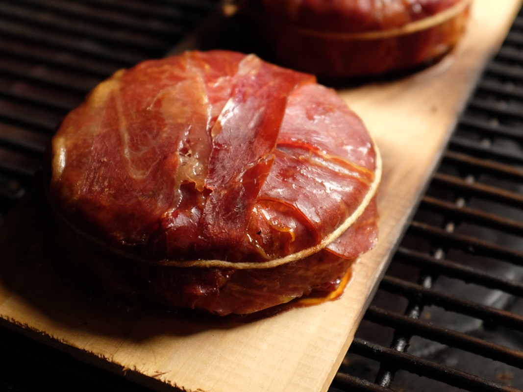 https://images.getrecipekit.com/20230619195428-recipe-49-prosciutto-wrapped-smoked-brie.jpg?aspect_ratio=4:3&quality=90&