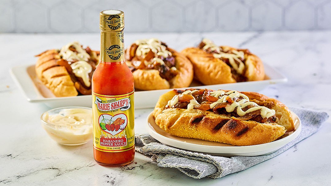 Image of Spicy Beer Brats with Onions with Marie Sharp’s Fiery Habanero Pepper Sauce