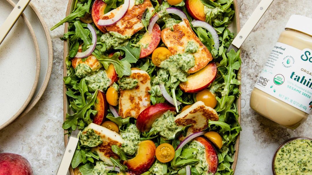 Image of Peach & Halloumi Arugula Salad with Tahini Pesto Dressing