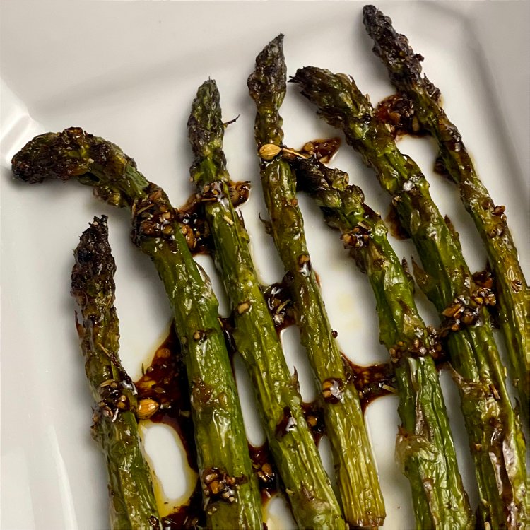 Image of Fire your grill and lay the marinated asparagus perpendicular to...