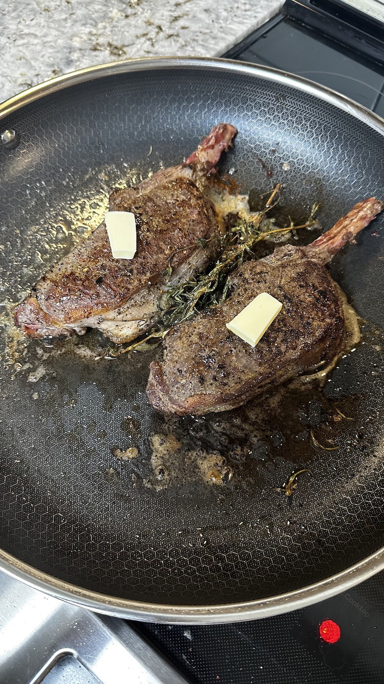Image of Once you've seasoned your chops and your pan is heated, add them to the pan and sear for two-three minutes per side. When you flip your chops, add a small slice of butter to the pan. After searing the second...