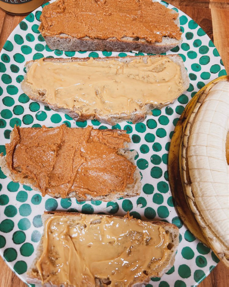 Image of Smear peanut butter on the opposite slices.