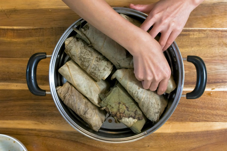 Image of Repeat the steps to wrap the rest of of the lo mai gai.