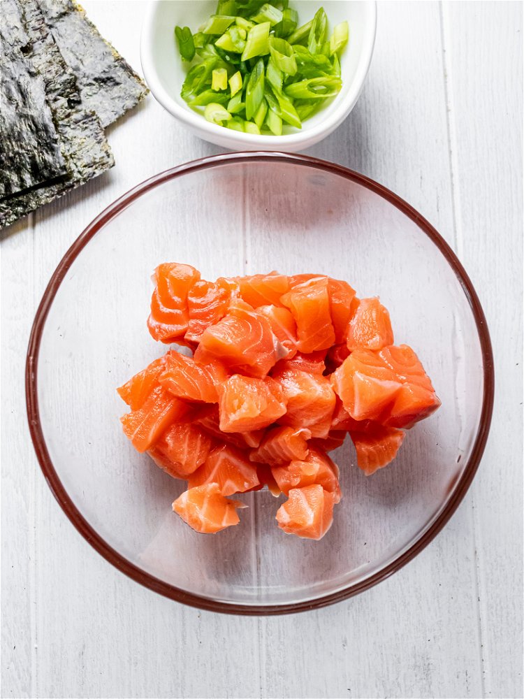 Image of Remove skin from salmon and slice into bite sized squares....