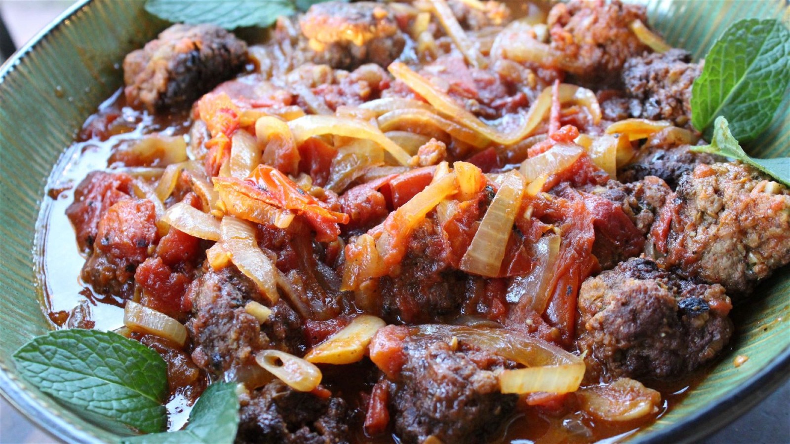Meatballs garnished with mint