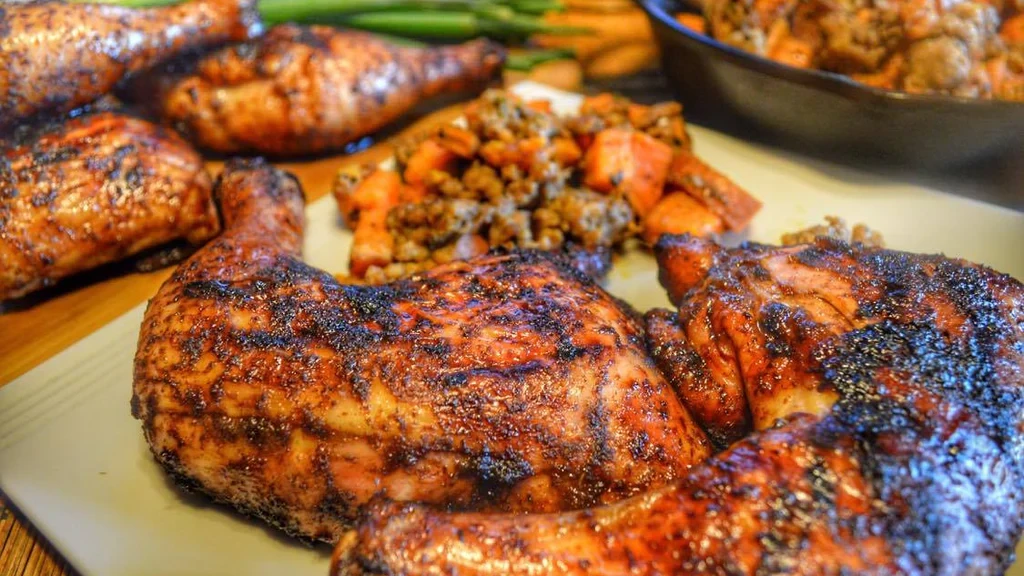 Image of Jamaican Jerk Chicken with Roasted Sweet Potatoes w/ Herbs and Sausage