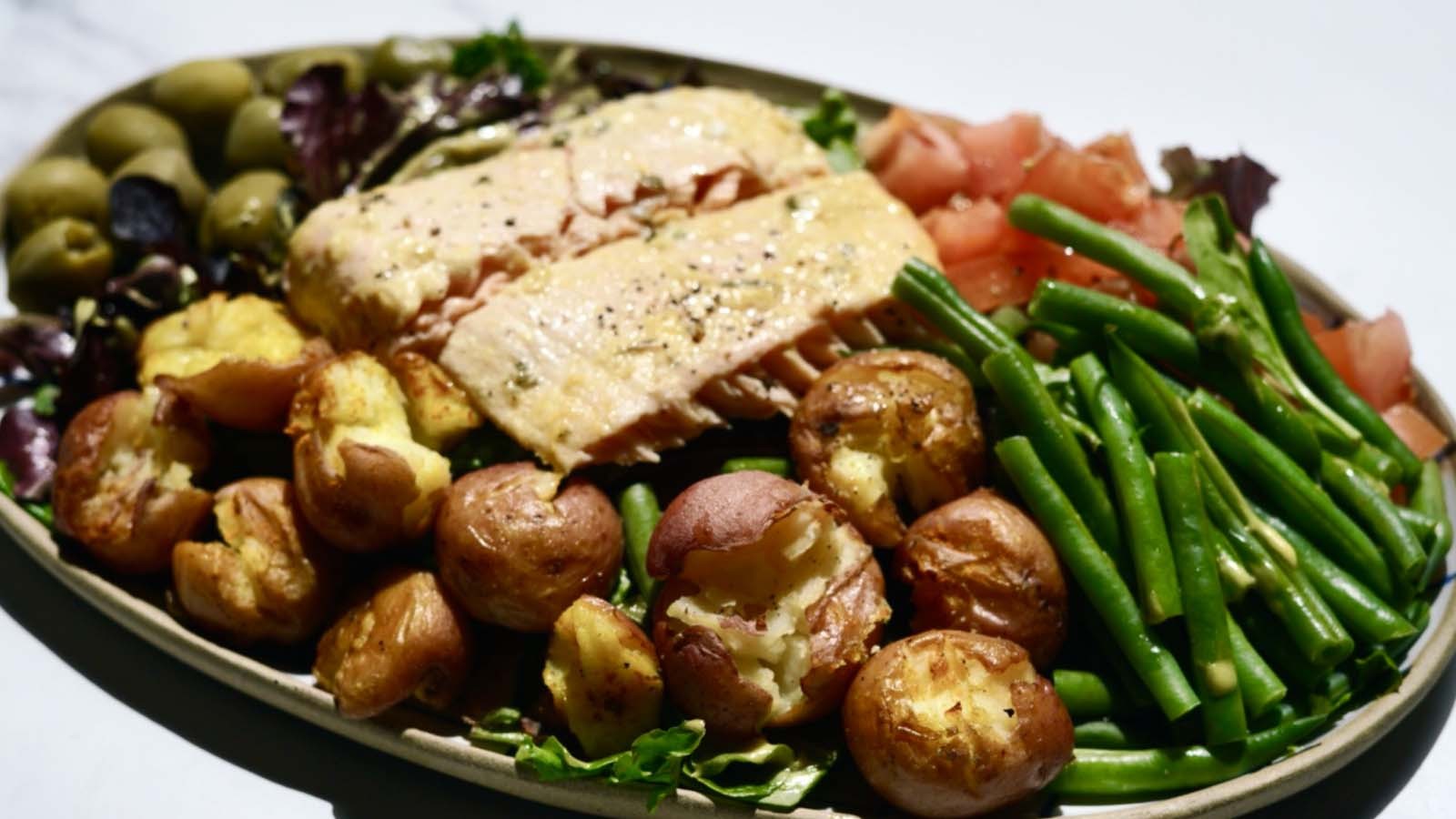 Image of Salmon Nicoise Salad with Roasted Smashed Potatoes & Turmeric Dressing