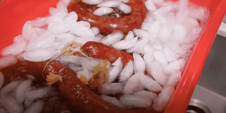 Image of Remove the smoked bologna from the smoker and give it an ice bath to cool rapidly down below 110 degrees.