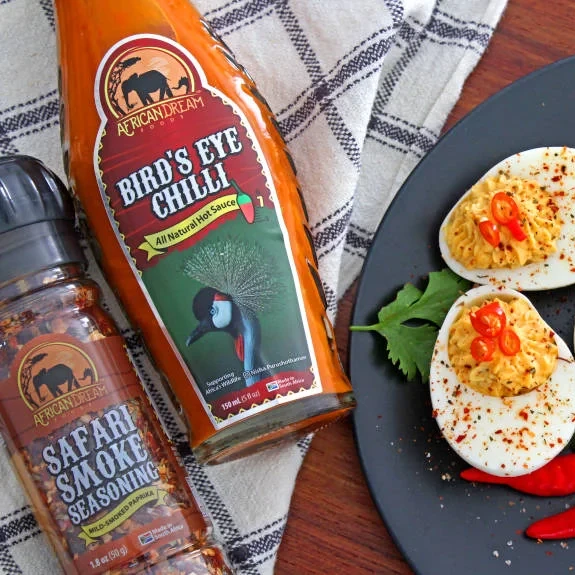 https://images.getrecipekit.com/20230720082154-spicy-deviled-eggs-3-min.webp?aspect_ratio=1:1&quality=90&