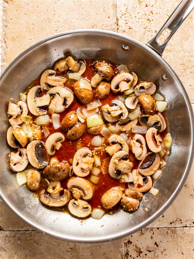 Image of Add Marsala wine to skillet and reduce heat to low....