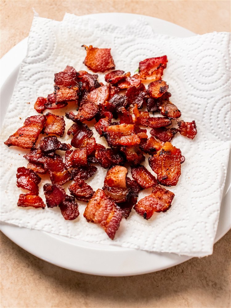 Image of Slice bacon into bite-sized pieces and transfer to a skillet...