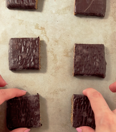 Image of Cut each Aloha Chocolate Caramel Pecan Protein Bar in half,...