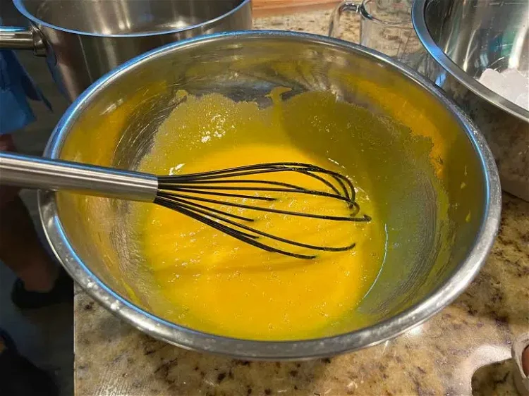 Image of Put egg yolks in a mixing bowl, add the sugar...