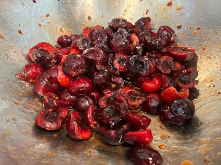 Image of Place cherries in mixing bowl and add the simple syrup....
