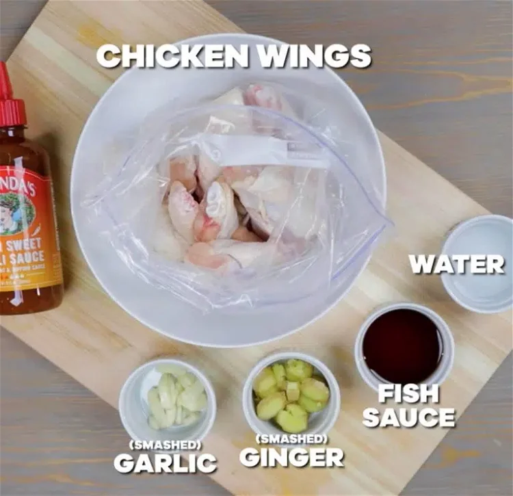 Image of Open Ziplock bag and add chicken wings with Melinda’s Thai...