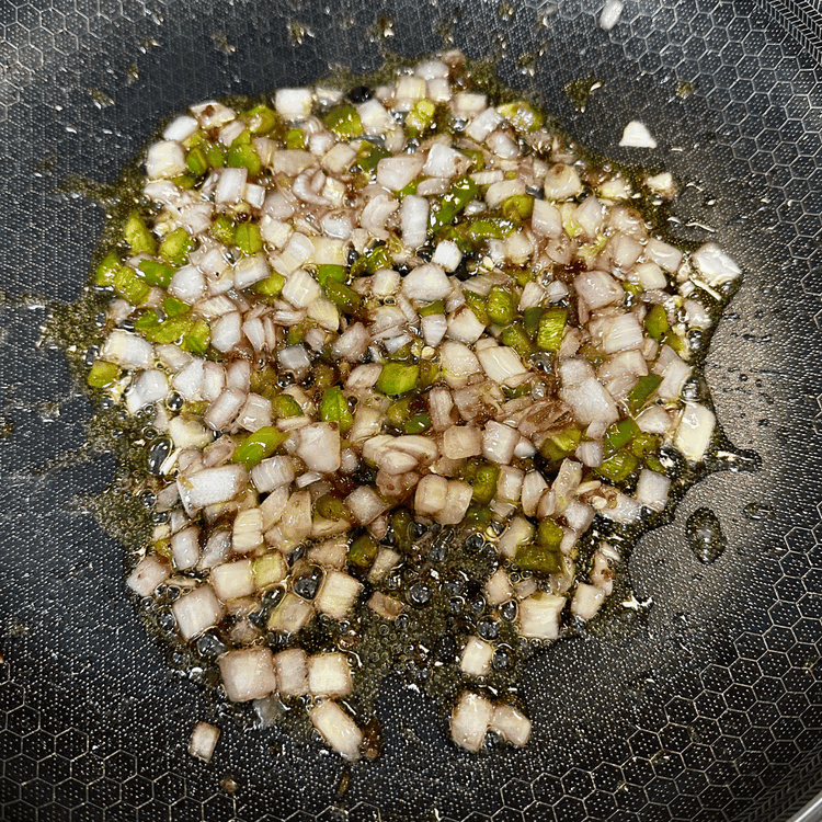 Image of While your brats are cooking, heat up another skillet over medium heat with 1/2 tablespoon of olive oil. Add the onions, jalapeno, huckleberry jelly/jam, and pepper relish to the skillet and cook until onions are translucent, and the jalapeños are...
