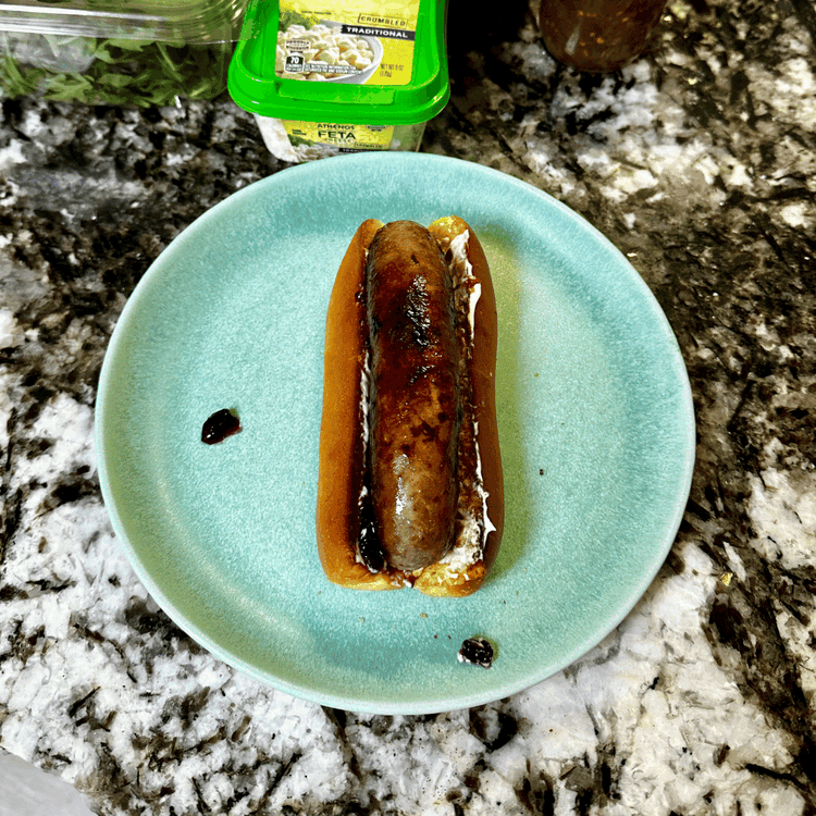 Image of Slightly toast your hotdog buns. Rub the inside of the bun with a little mayonnaise and huckleberry jelly/jam. Set your brat on the bun. 