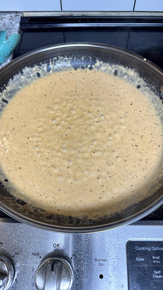 Image of Add the butter to a pan and melt. Whisk in the cream. Simmer over low heat for approximately two minutes. Add in the garlic and two tablespoons of the cajun seasoning. Whisk for one minute. Add in the parmesan cheese...