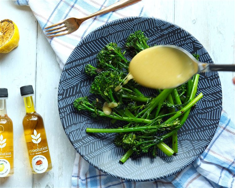 Image of Divide broccolini between plates and drizzle with dressing. Top the...