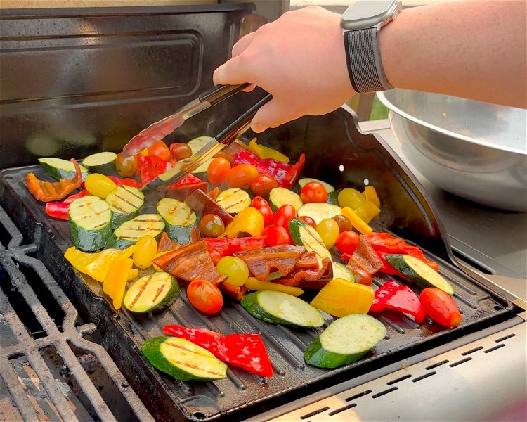 Image of Chop the peppers and zucchini into bite-sized pieces and place...