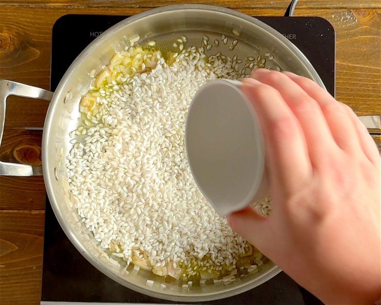 Image of Add the rice and cook for another 2-3 mins while...