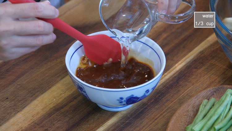 Image of Add oil to the wok and saute the yard beans over medium heat for a few minutes or until soft. Remove the yard beans to the side and leave the oil behind. It is best to cook the yard beans...