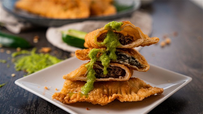 Image of Chebureky with Green Ajika Sauce - Ukrainian Fried Turnovers