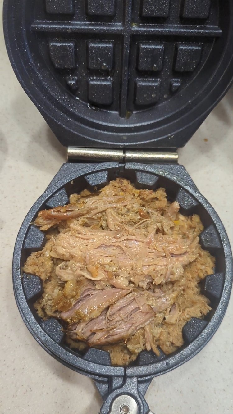 Image of Pack the mofongo mixture firmly into the waffle iron on...