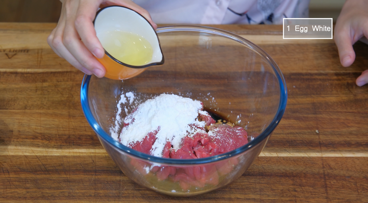Image of Last, add a drizzle of oil to coat the beef. This will separate the meat slices, making them easier to stir fry later.