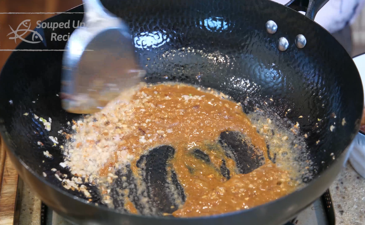 Image of Add the minced shallot, garlic, and ginger. Stir over low heat until they are slightly golden on the edge. Pour in the sauce and continue to mix, allowing everything to infuse together, creating sublime flavors. Your entire house should smell...