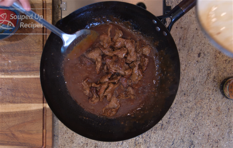 Image of Introduce the beef back into the wok and mix well....